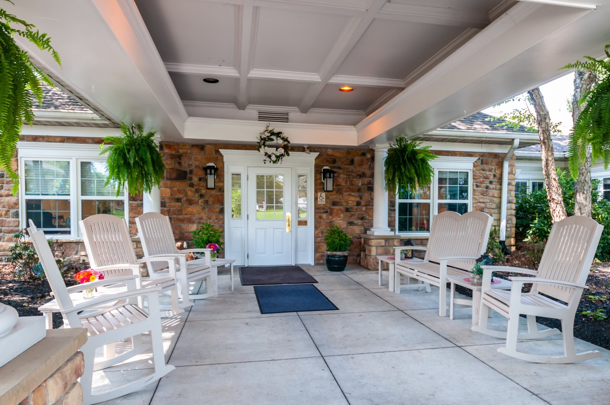A welcoming entrance with seating area and decorative plants.
