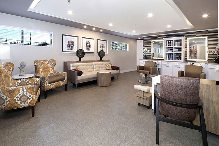 A modern lounge area featuring stylish seating and contemporary artwork.