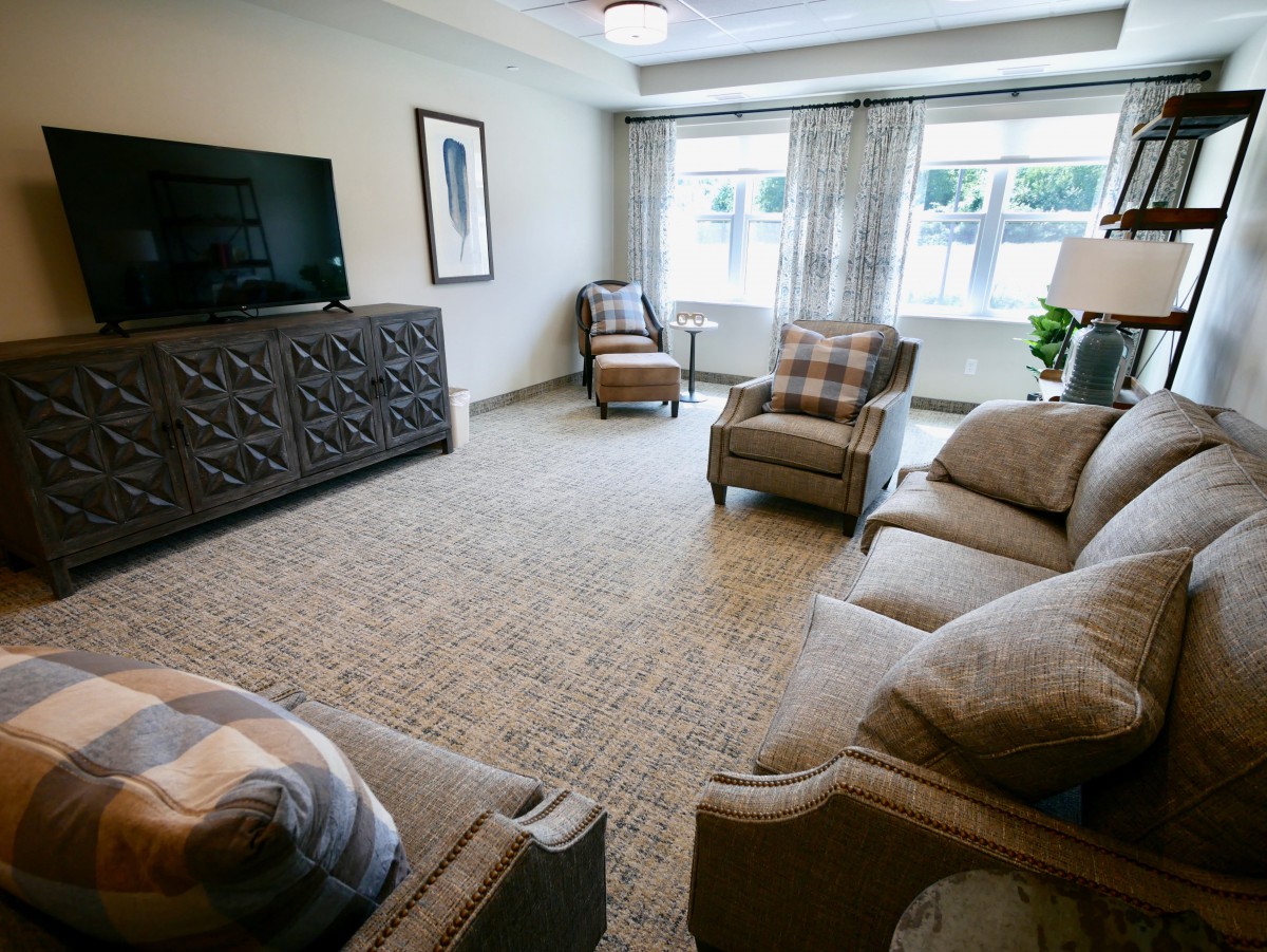 A cozy living room with comfortable seating and a television.