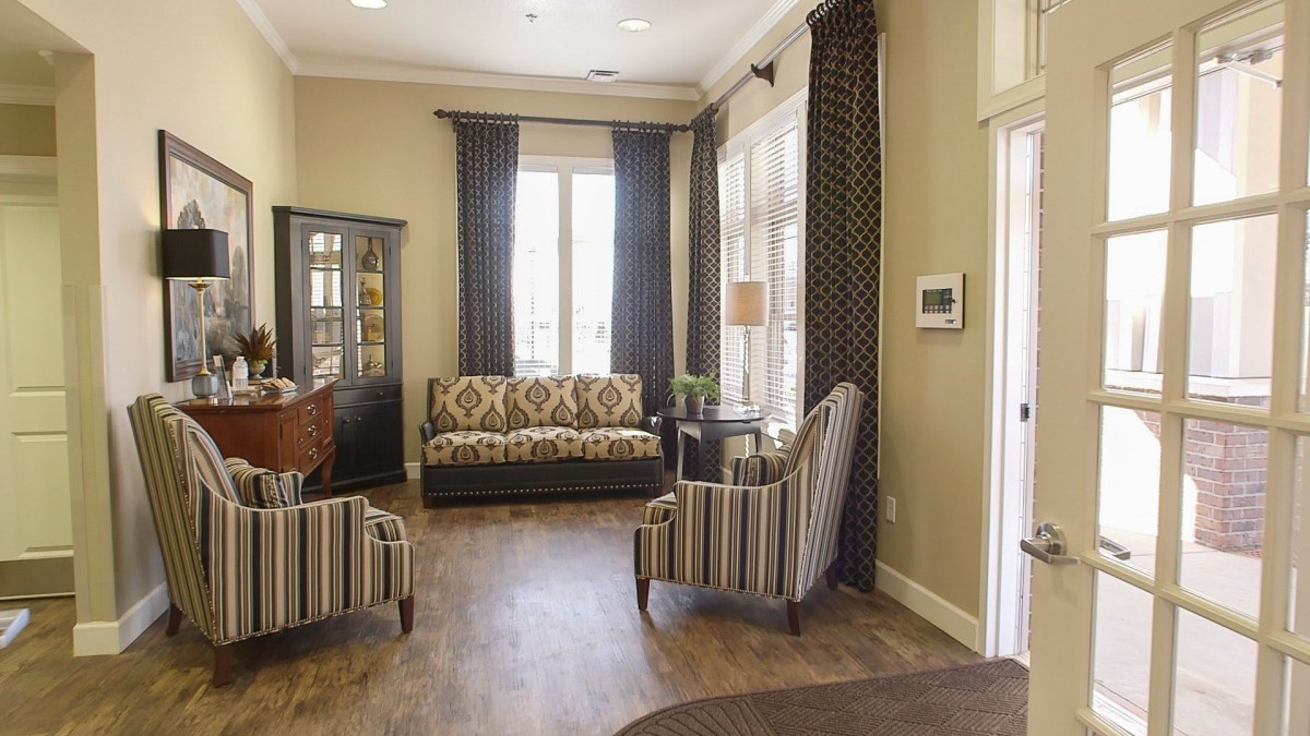 A cozy living room with elegant furniture and natural lighting.