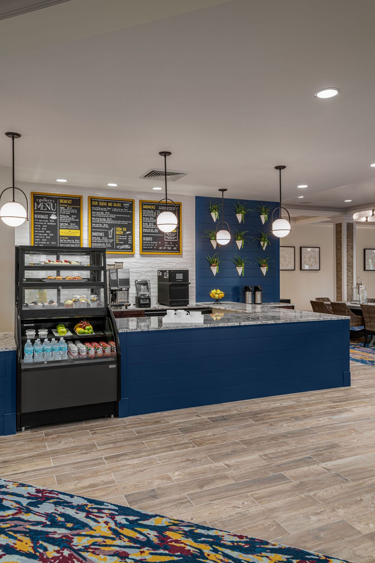 Modern cafe interior with a beverage counter and menu boards.