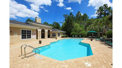 A beautiful backyard pool under a clear blue sky, perfect for relaxation.
