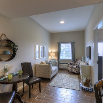 A cozy and modern living room featuring stylish furniture and warm lighting.