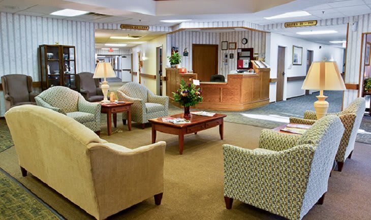 A cozy lobby reception area with comfortable seating and a welcoming atmosphere.
