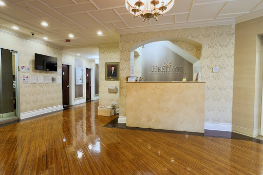 A welcoming reception area featuring elegant design and polished wood flooring.