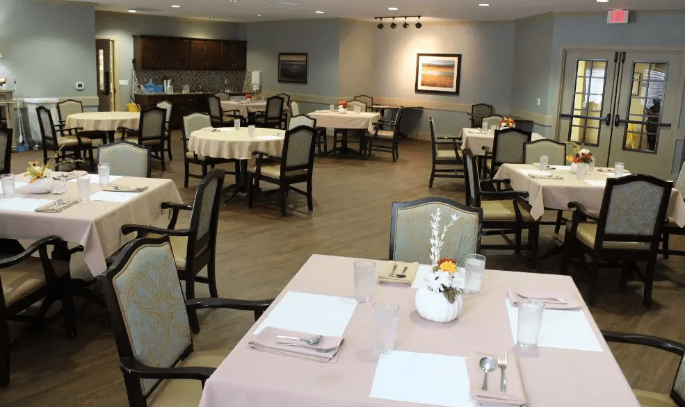 An elegant dining room with neatly arranged tables and chairs, ready for guests.