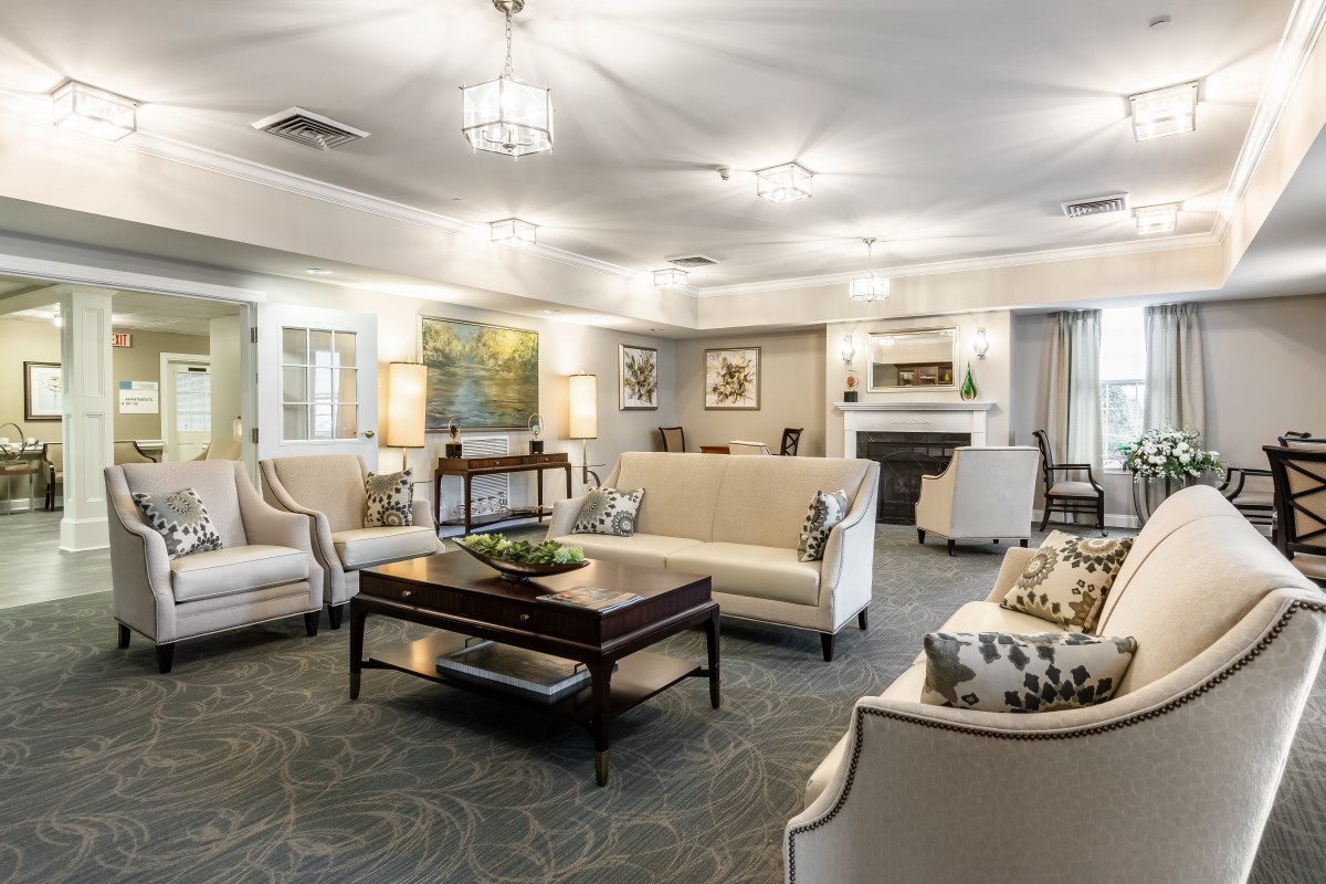 A spacious and elegantly designed living room with comfortable seating and sophisticated decor.