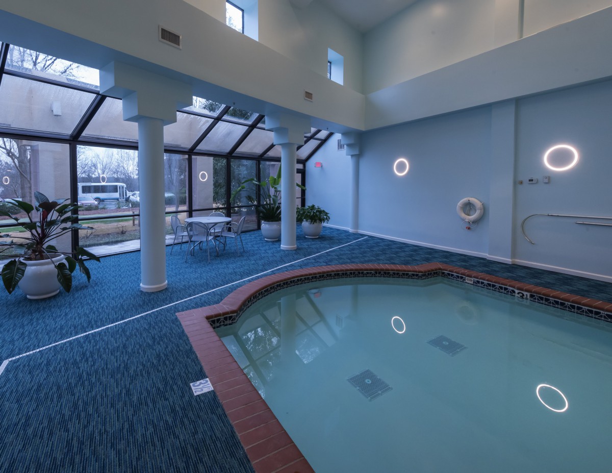 An inviting indoor pool area with large windows and a modern design.
