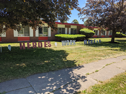 A display at a school highlighting the theme of heroes and work.