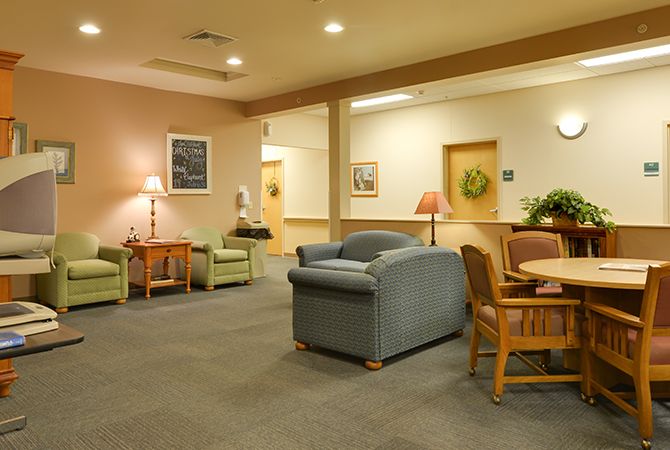 A cozy lobby area with comfortable seating and warm lighting.
