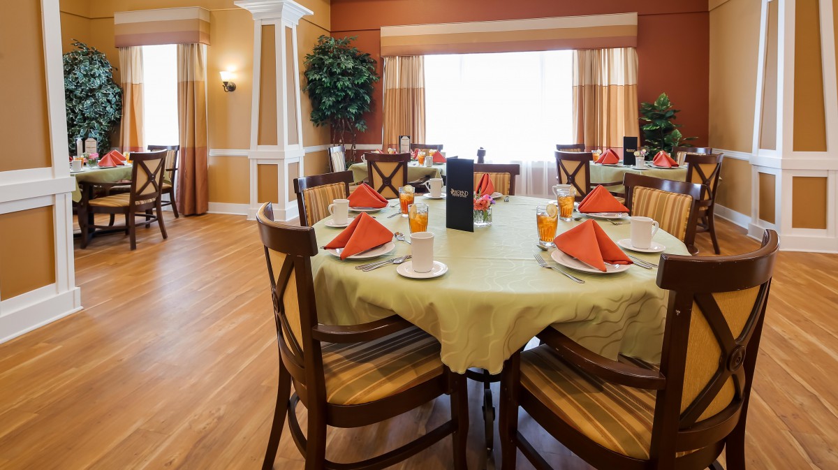 A beautifully set dining table with elegant decor in a restaurant setting.