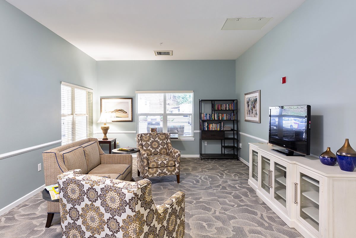 A cozy living room with modern furniture and elegant decor.