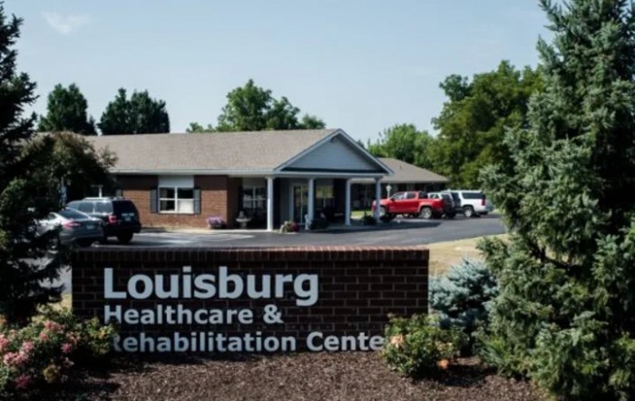 Louisburg Healthcare & Rehabilitation Center exterior view with signage.
