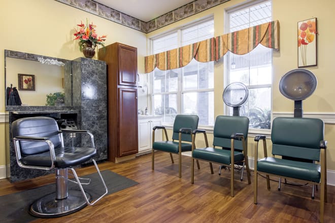 A cozy hair salon with a waiting area and styling station.