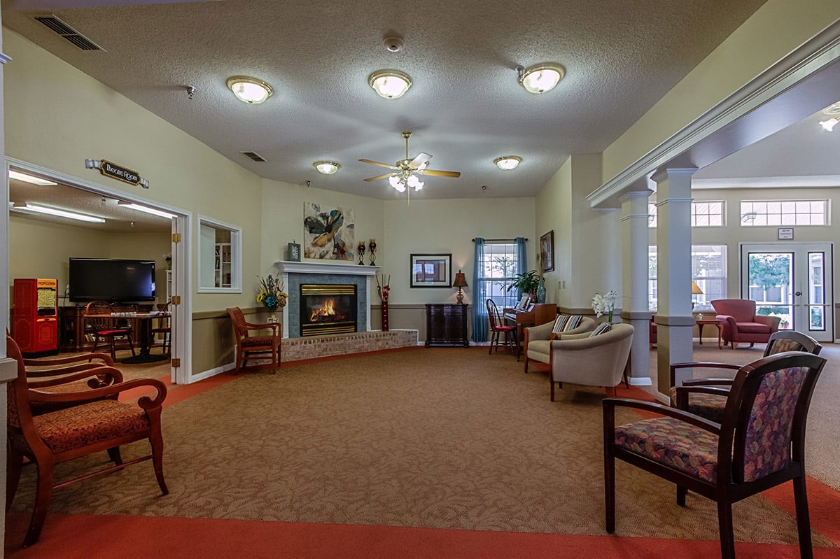 A spacious living room with a fireplace and comfortable seating.