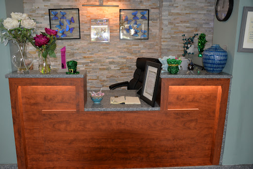 A modern reception area with floral decorations and a welcoming atmosphere.