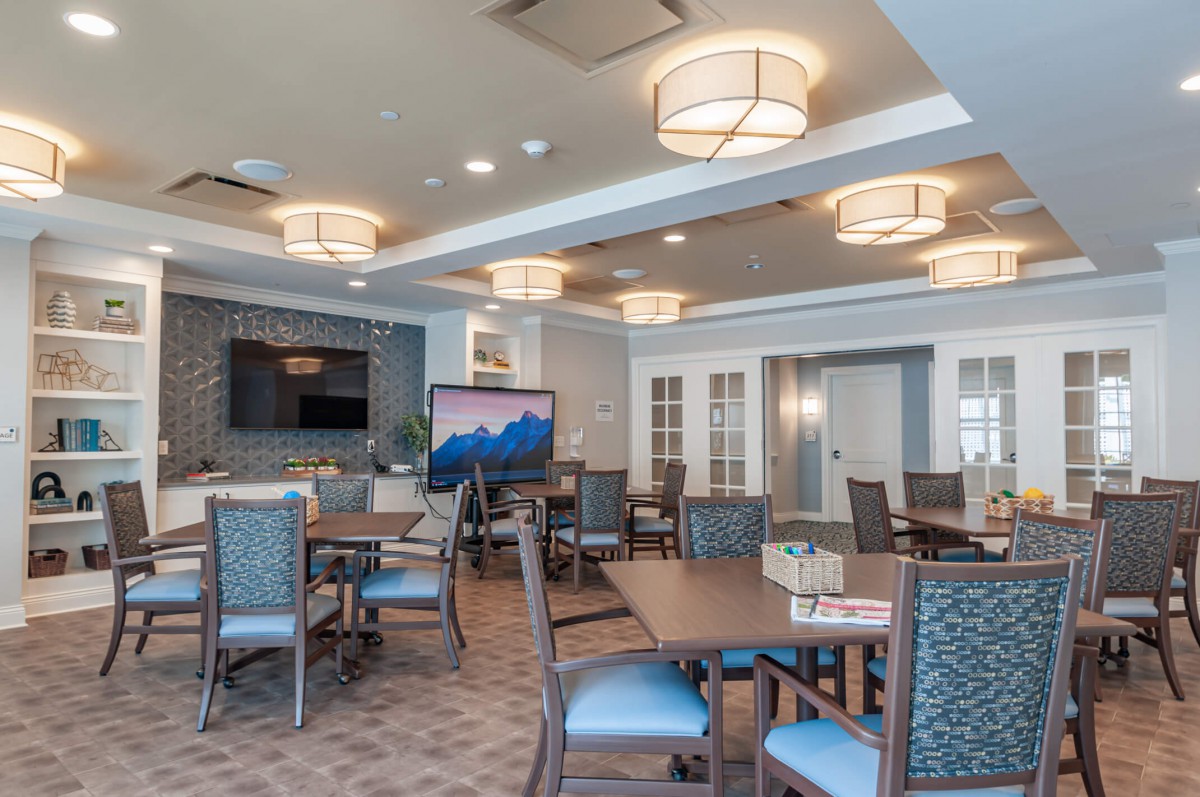 A modern dining area with elegant lighting and furnishings.