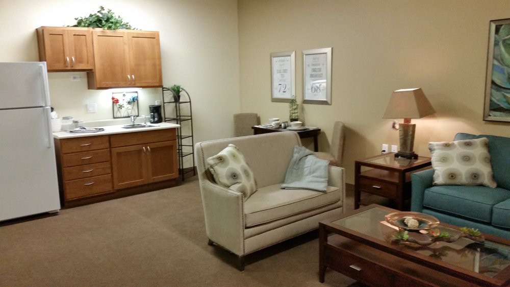 A cozy living room setting with a sofa, coffee table, and tasteful decor.