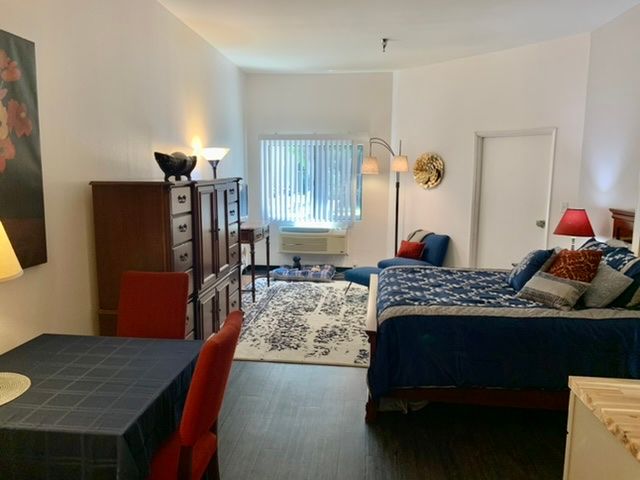 A cozy bedroom with stylish furniture and decor.