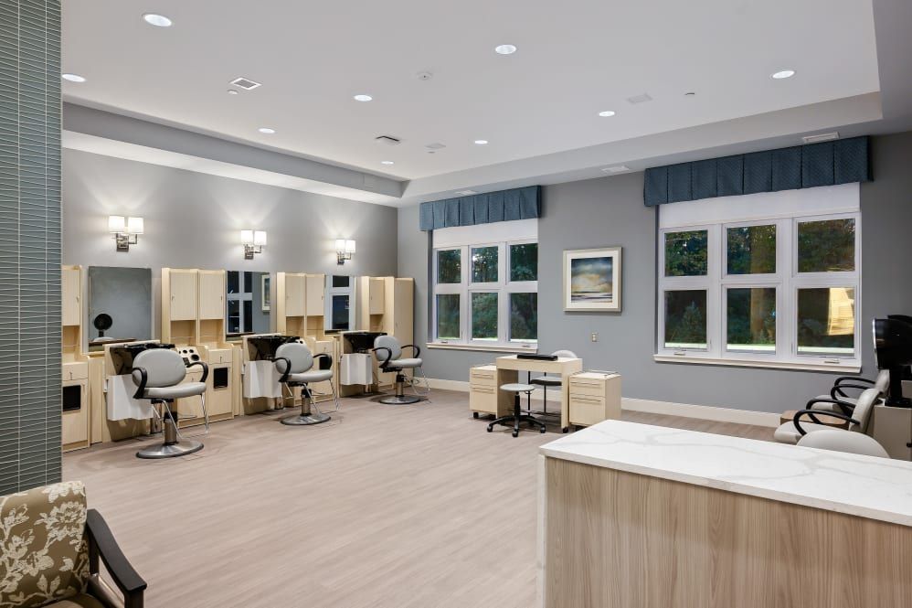 A modern hair salon with sleek design and comfortable seating.