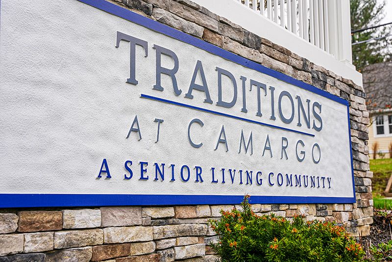 Sign for Traditions at Camargo, a senior living community.