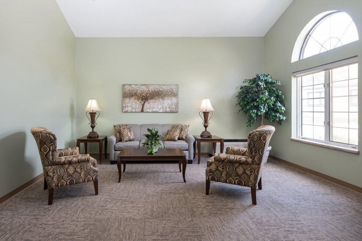 A cozy living room with elegant furniture and decor.