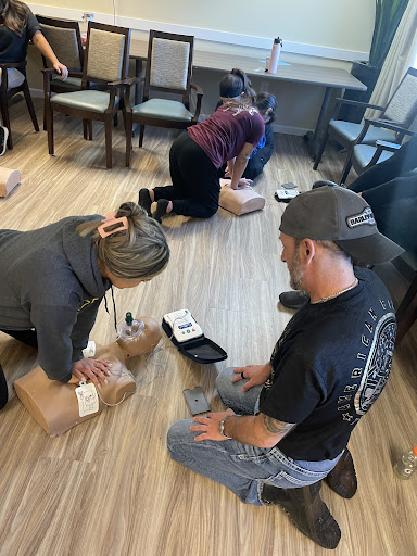 A group of individuals working together on packaging items in a collaborative workspace.