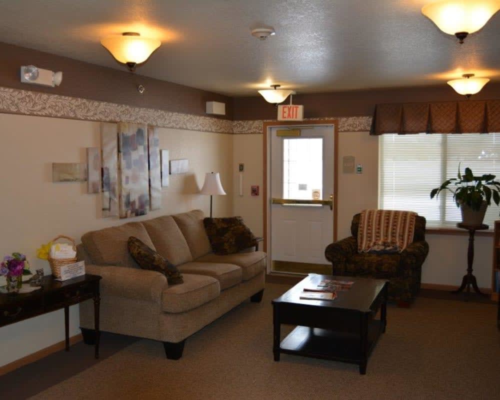 A cozy living room featuring comfortable furniture and warm lighting.