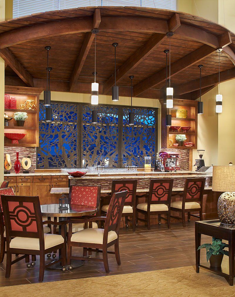 A cozy bar interior featuring decorative elements and seating arrangements.