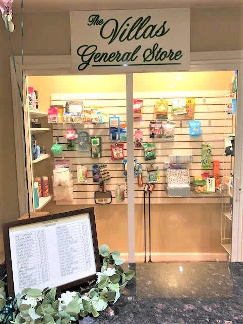 A small general store display with various products on shelves.