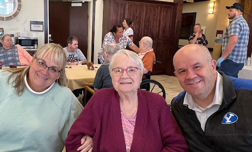 A joyful moment shared among loved ones in a senior living community.