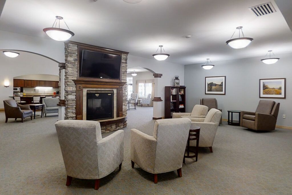 A cozy living room with comfortable seating and a fireplace under a modern dcor.