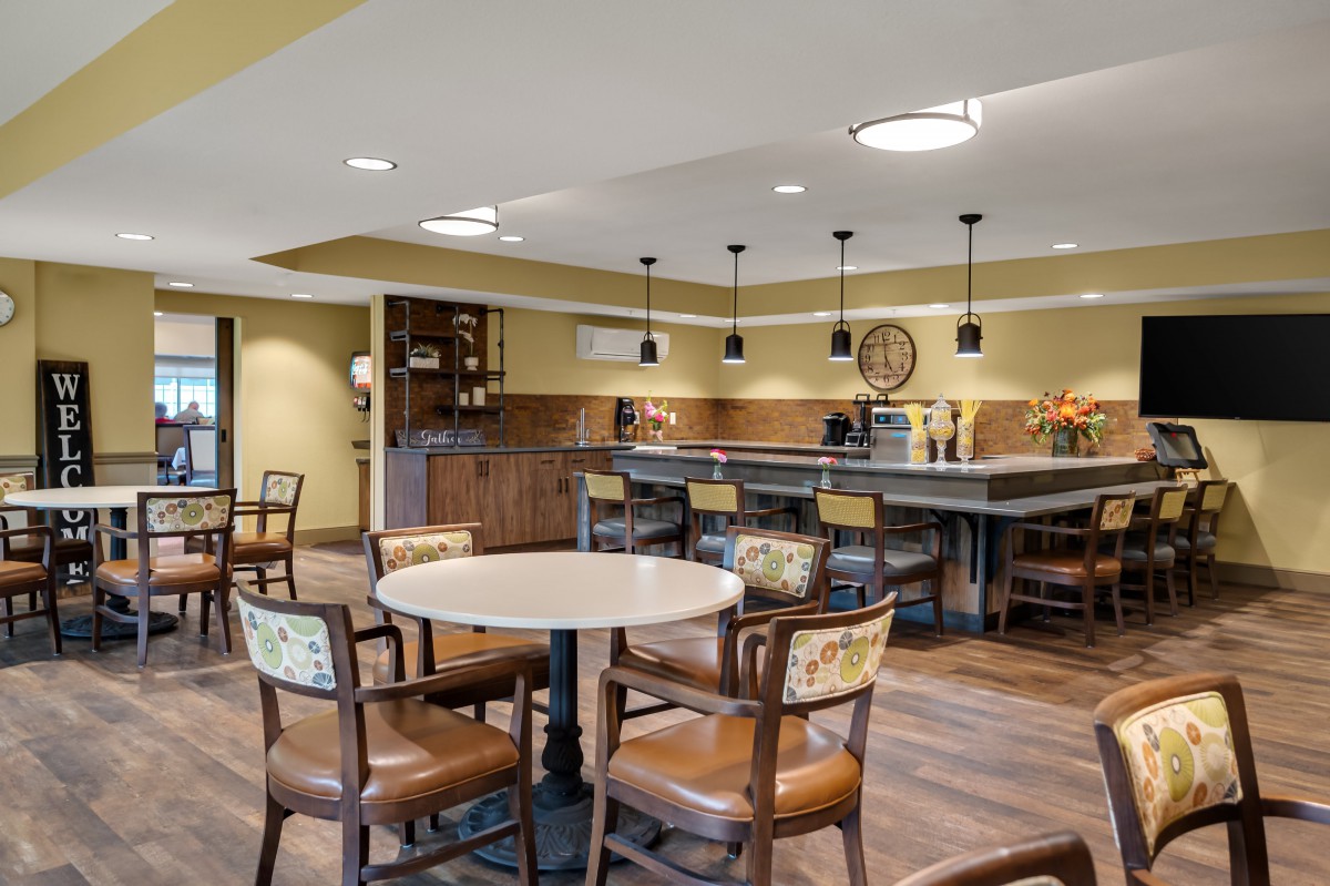 A cozy and spacious dining area with modern kitchen amenities and comfortable seating.