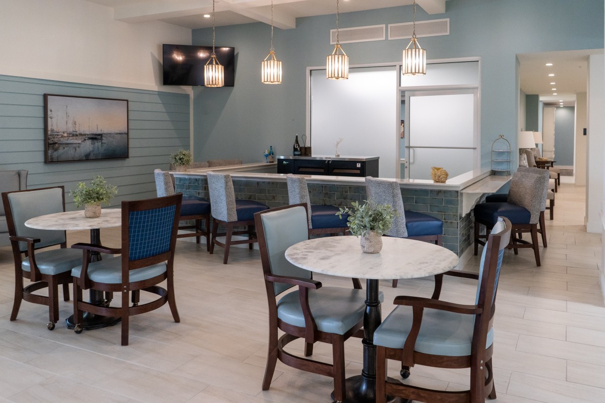 A cozy and modern cafe interior with elegant seating arrangements and stylish lighting.