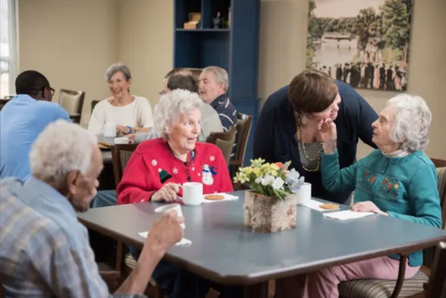 A group of seniors socializing in a community setting.