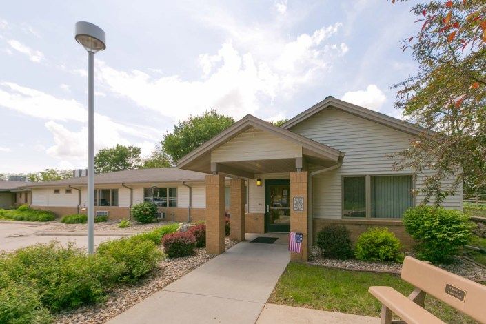 A suburban residential house with a well-maintained front yard and pathway.