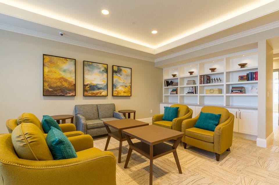 A modern, cozy living room with comfortable seating and stylish artwork.
