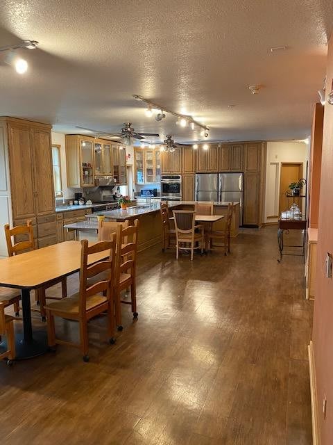 Spacious kitchen and dining area with modern wooden furnishings.