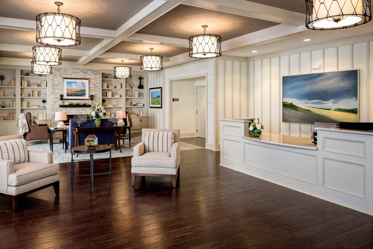 A modern lobby with a comfortable seating area and stylish reception desk.