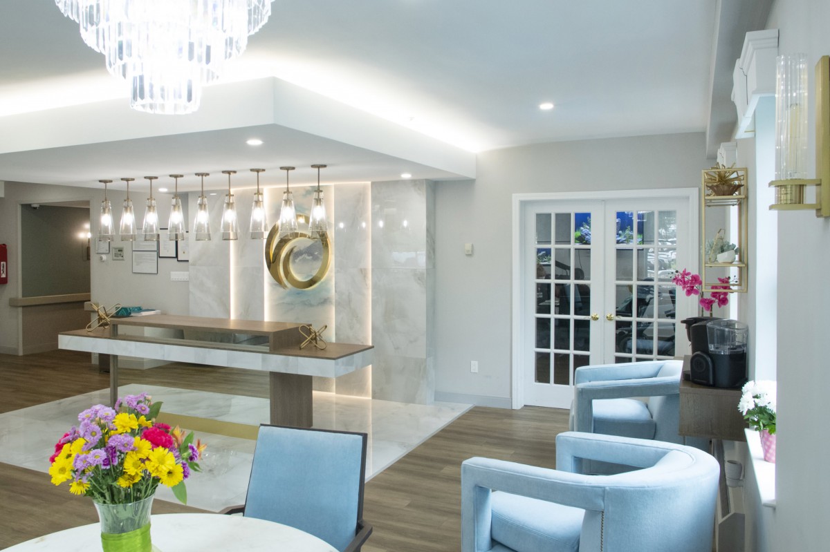 A modern and elegant living room interior with contemporary furniture and stylish lighting fixtures.