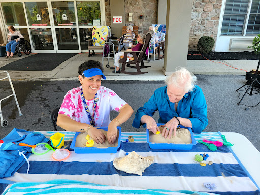 Engaging in a fun arts and crafts session, bringing together different generations.