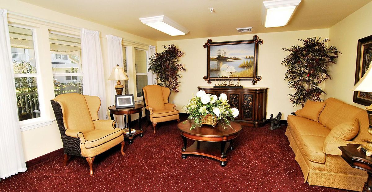 A cozy living room with classic furniture and elegant decor.
