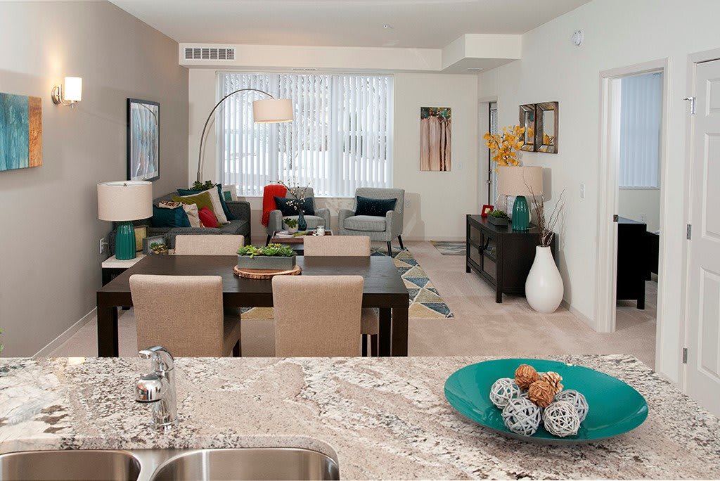 A modern open-plan living and dining area with contemporary furnishings and decor.