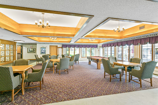 A spacious and inviting recreation room with comfortable seating arrangements and natural light.
