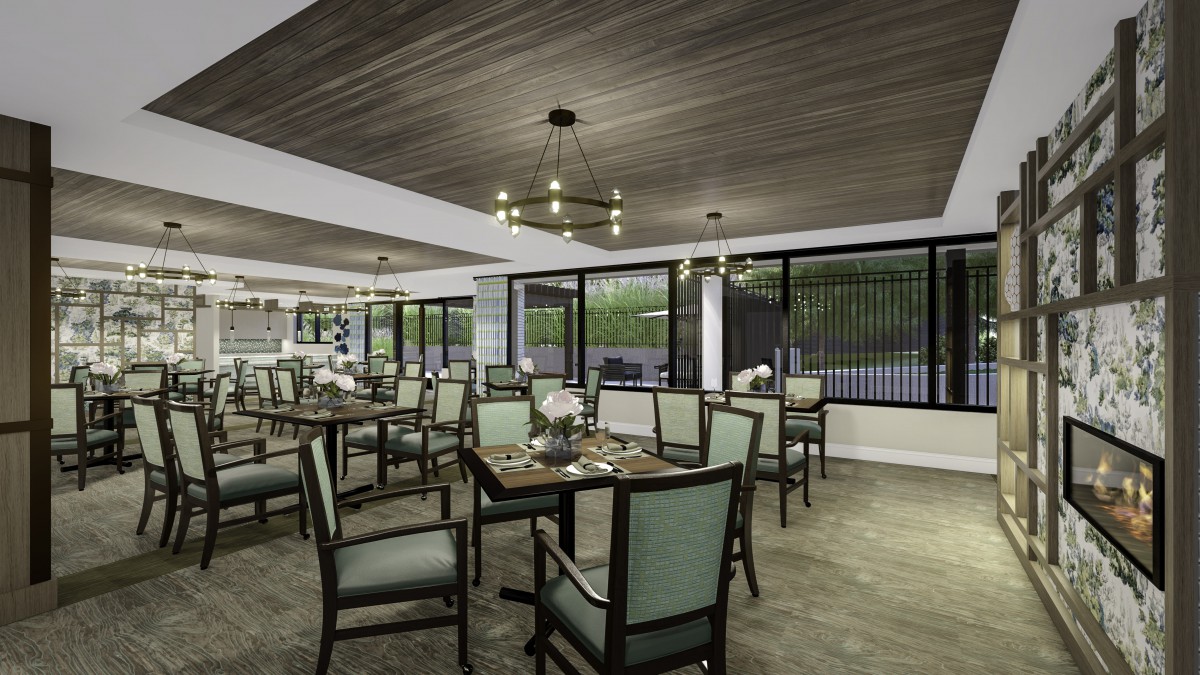 A modern restaurant dining area with neatly arranged tables and chairs, accented by stylish chandeliers and large windows.