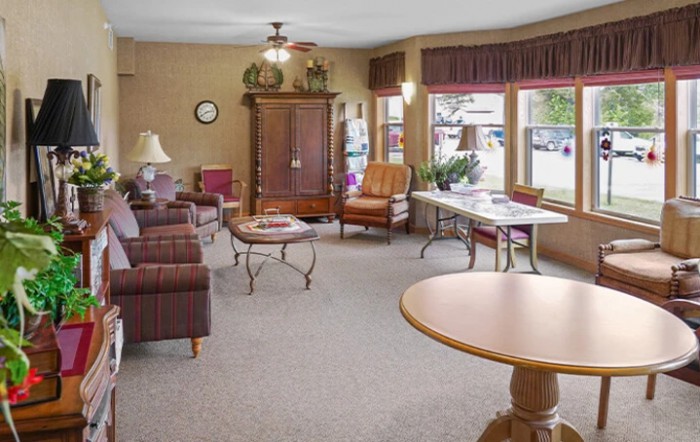 A cozy living room with comfortable seating and ample natural light.