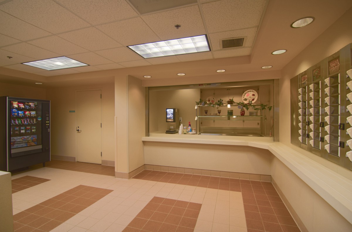 A hospital reception area with a counter and waiting space.