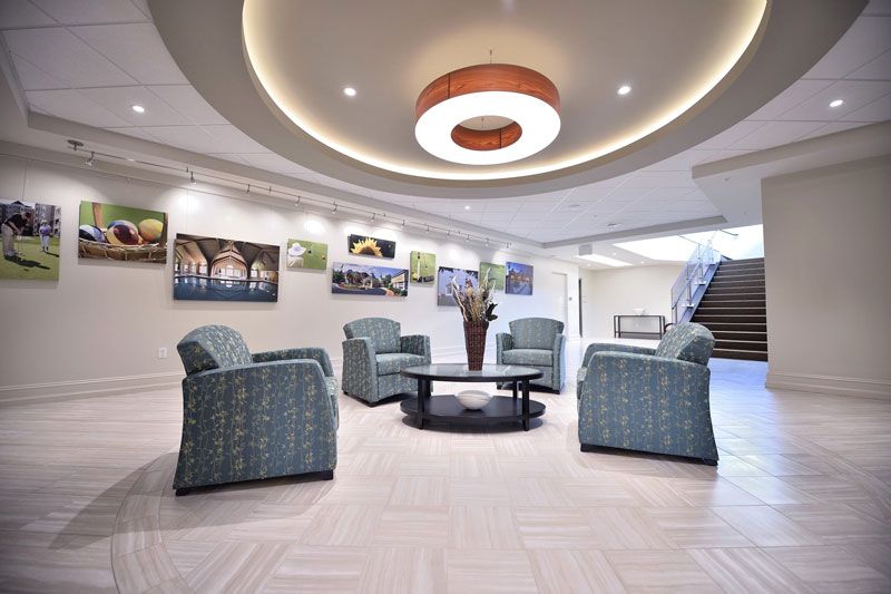 A modern lobby with comfortable seating and decorative artwork.