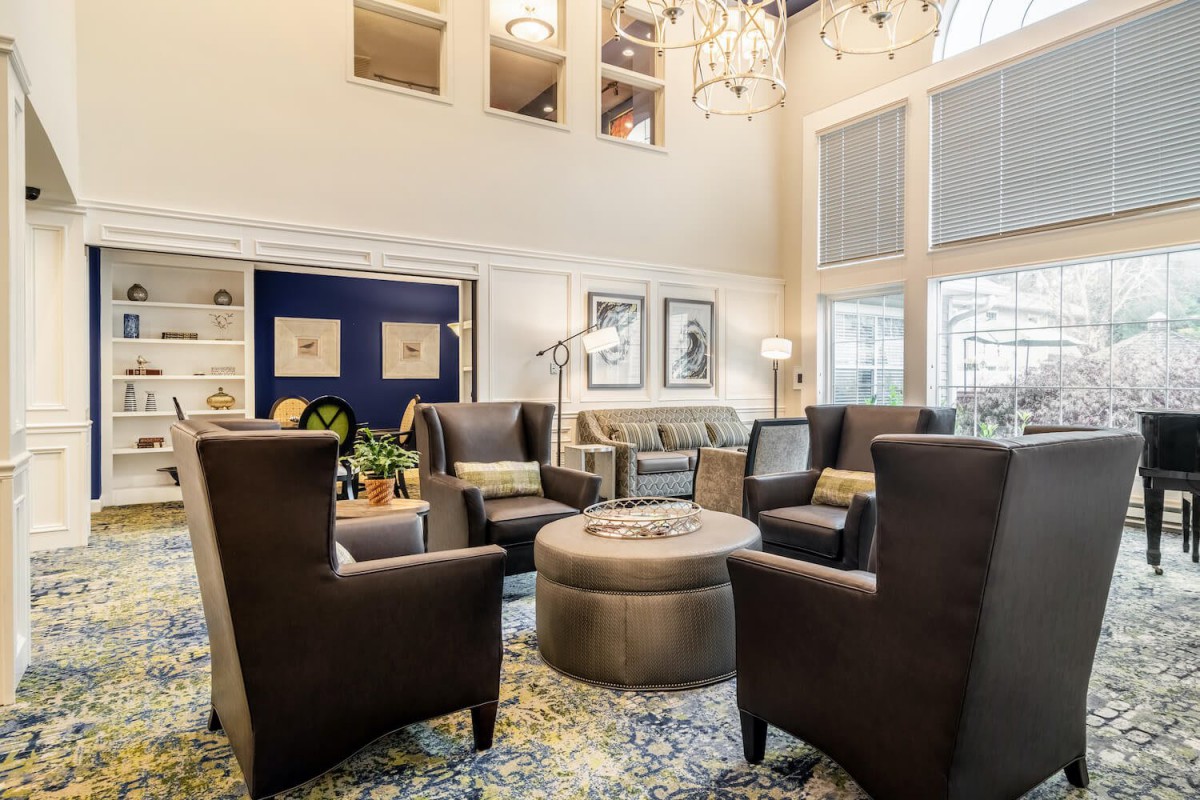 A modern and cozy living room with stylish seating and elegant decor.