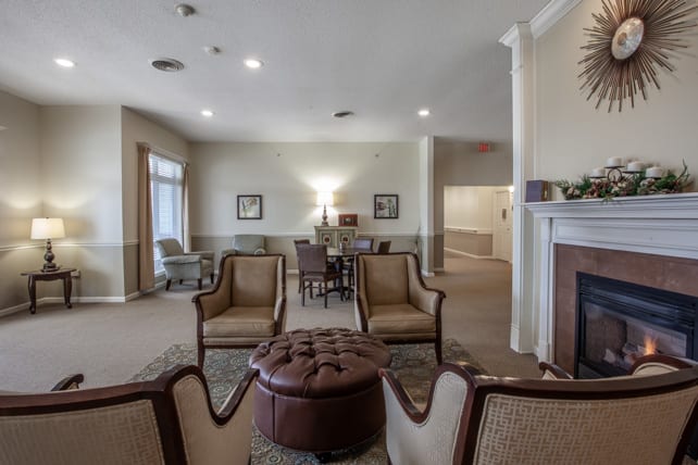 A spacious living room with elegant furniture and a cozy fireplace.